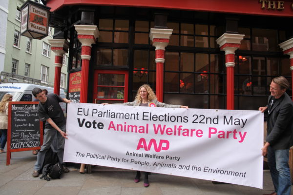 Soho pub, The Coach and Horses lends its support to the Animal Welfare Party’s EU election bid with a statement banner and staff decked out in AWP t-shirts